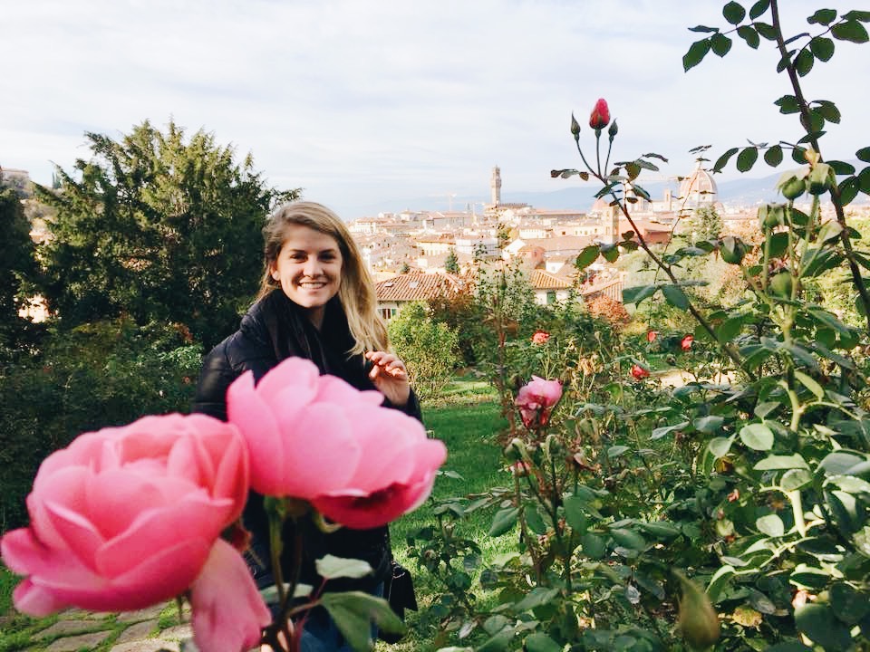 Hallie amongst the flowers in Florence with the Duomo and skyline in the background.